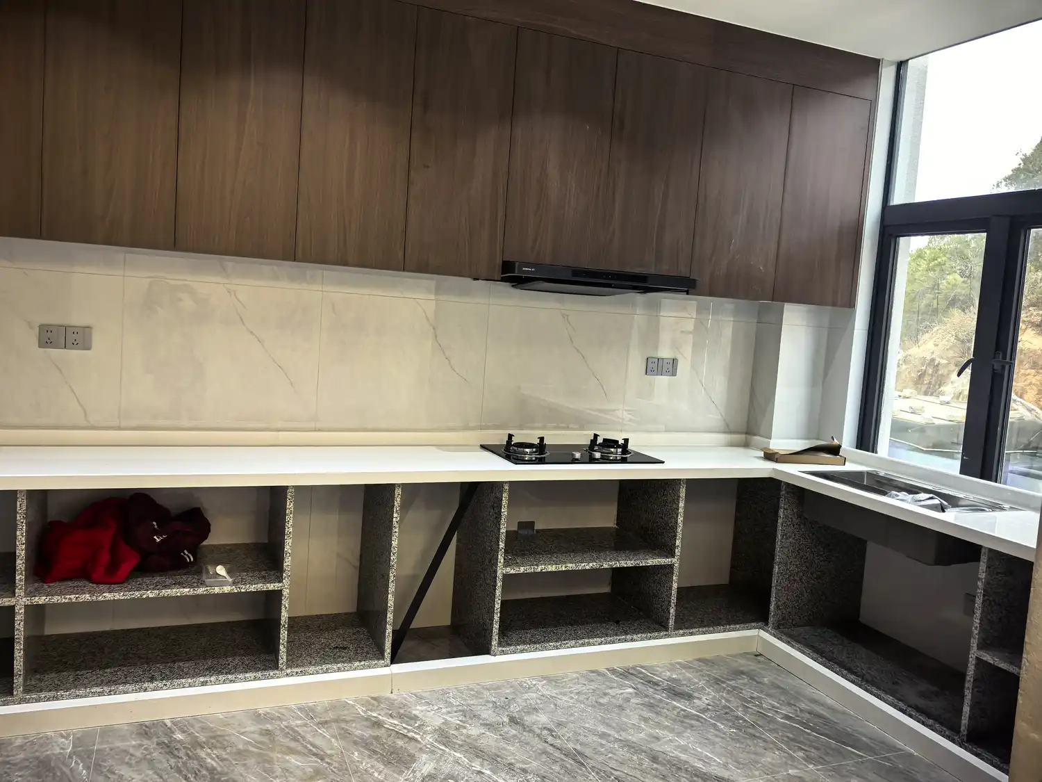 Calacatta marble kitchen countertop and full-height backsplash