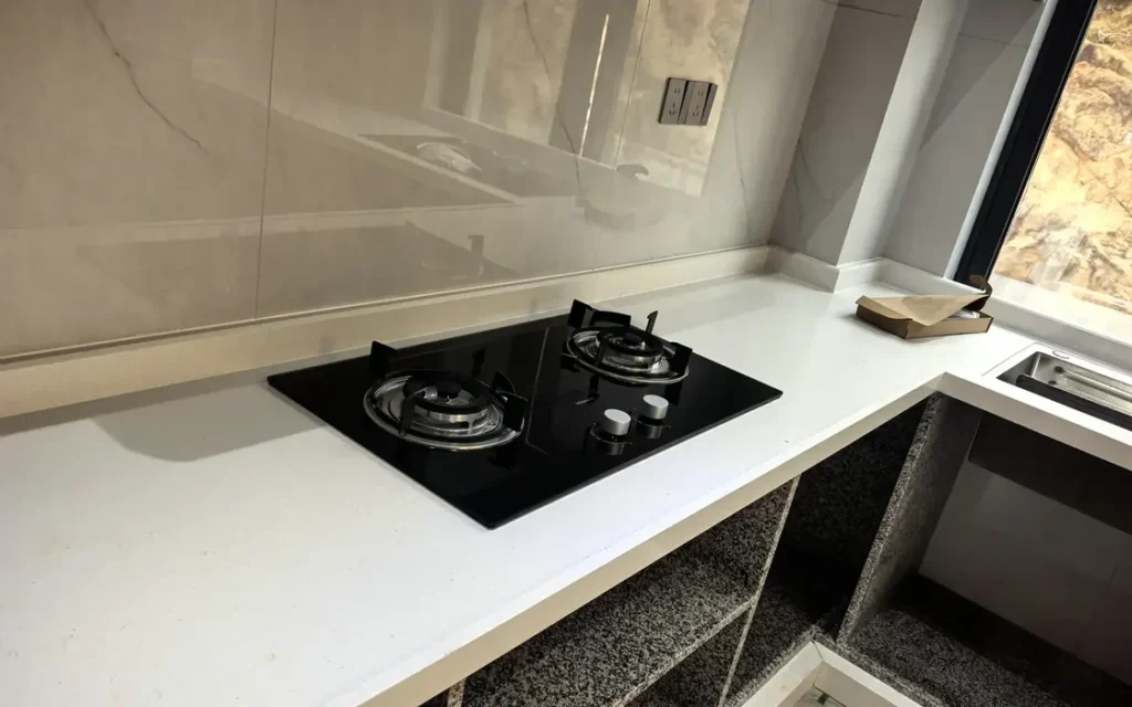White countertop and backsplash in a kitchen